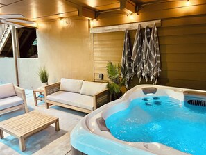 Sit back and relax in our outdoor lounge! Unwind in the seven seat hot tub.