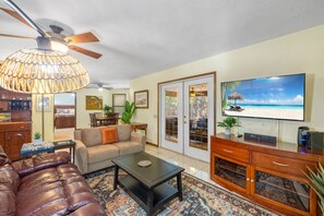 Living room with 55" TV and reclining seating