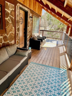 main level balcony wraps around house. Great place to have coffee.