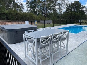 Private self cleaning refreshing salt water pool only for your group is next to the large hot tub for 10 people  and tables and chairs for 6 