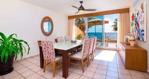 Ocean-view dining area in Villa del Palmar's luxury suite.