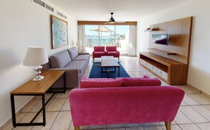 Chic, cozy living space with ocean backdrop at Villa del Palmar.