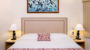 Elegant suite bedroom with artful touches at Villa del Palmar Los Cabos.