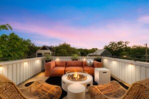 Rooftop lounge are with fire pit.