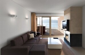 Living area and balcony with sea view