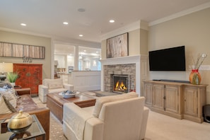 Bright living area with a fireplace and TV, perfect for relaxation!