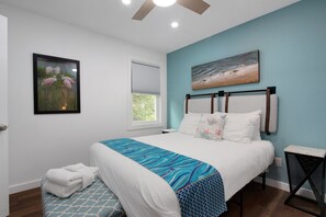 Bedroom 2 features a queen bed and ensuite  bathroom.