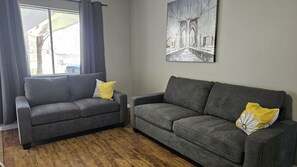 Indulge in comfort and relaxation in our inviting living room, the ideal spot for unwinding and entertainment.