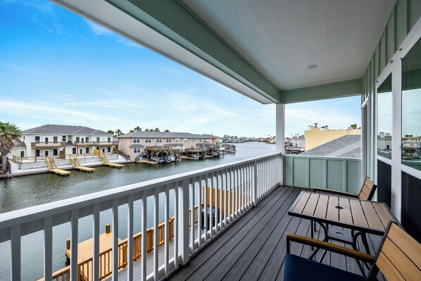 Balcony off of master bedroom with views of the canal