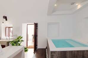 Enjoy moments of relaxation in the interior hot tub