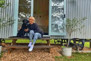 Hut guest relaxing with her dog
