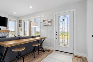 The view towards the front door from main bedroom doorway.