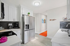 Whip up delicious meals in our well-appointed kitchen, equipped with modern appliances and everything you need for culinary adventures.