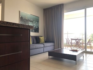 Modern elegance meets cozy comfort in our open-plan kitchen/living room.