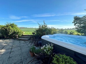 Seven seater hot tub with wonderful views of the surrounding countryside