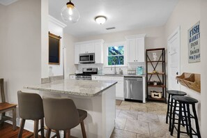 Where cooking becomes a social affair - pull up a stool and let's stir up some fun!
