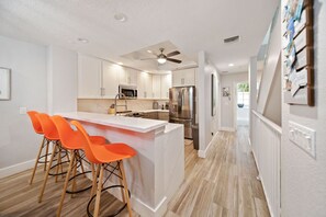 Gorgeous modern kitchen with new appliances and 4 barstools