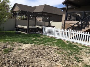 Pergola firepit with lighting and hot tub