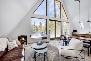Living room on main floor, custom leather sofa and modern furniture