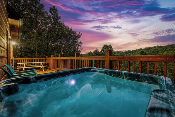 Enjoy unobstructed views of luscious greenery as you soak in the hot tub.