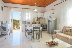 Dining and living area with charming views