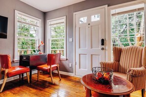 living room is in the middle of eastwood park surrounded by trees 