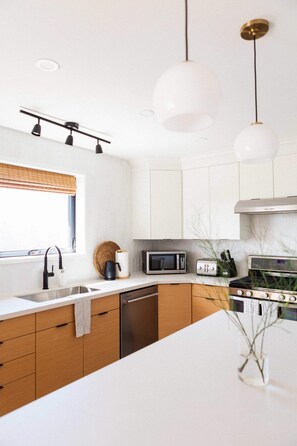 Beautifully renovated kitchen is bright + modern