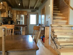Enjoy the open floor plan from the kitchen to dining room that flows right into the living room.  Enjoy this beautiful hand-crafted cabin with attention to every detail.