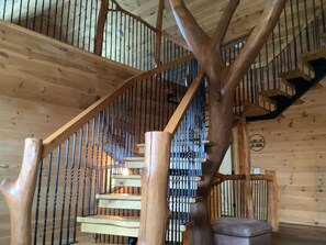 Hand crafted staircase leading to 2nd floor and 3rd floor.