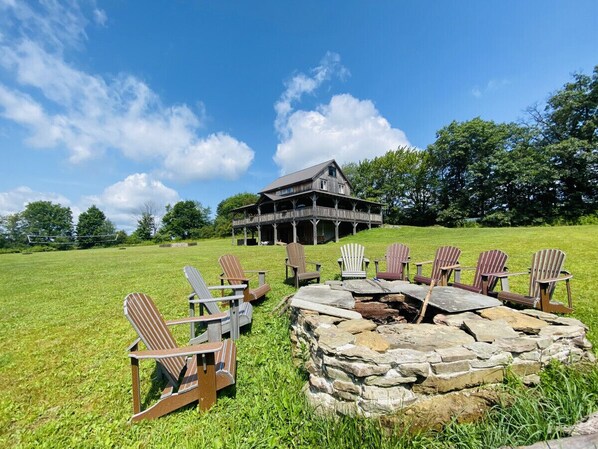 Enjoy the serenity of nature as the family gathers near this beautiful fire pit.