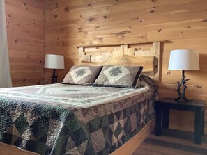 Relax and rest in this cozy second floor bedroom equipped with a comfortable queen sized bed to ensure a restful nights sleep.