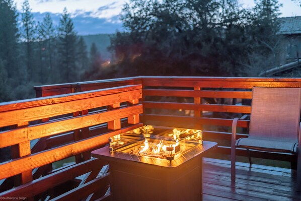 Enjoy Sunset, Drink and S'more by this fireplace table