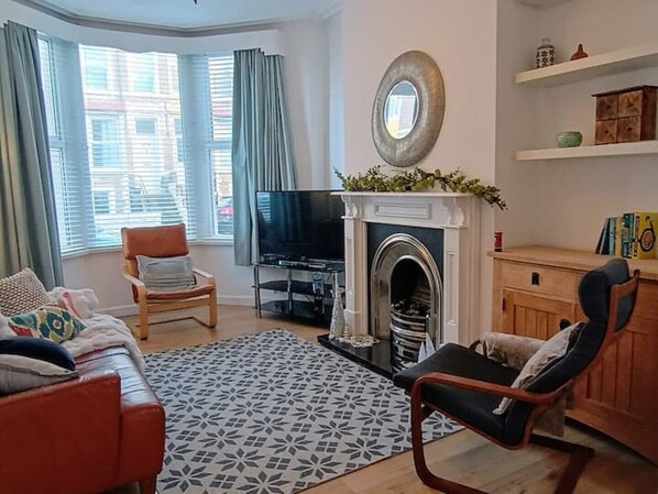 Main sitting room at the front of the house open with dining room and sea views