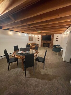 Basement Game room with Foosball,Darts, Poker Table, TV with Fire Stick, and Bar