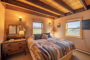 The main level has two bedrooms with queen beds and bathroom.