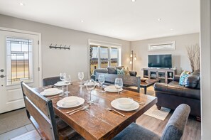 Open concept kitchen, living and dining area with streaming TV 