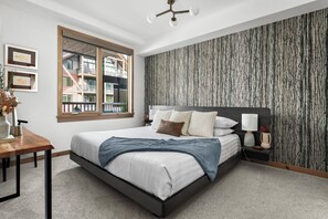 Gorgeous King-size premier suite w/ TV, walk-in closet, and spa tub.
