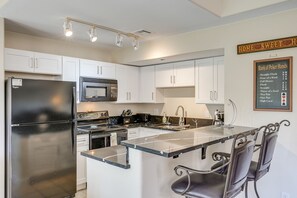 Kitchen | Central Air Conditioning | Free WiFi | In-Unit Laundry Area