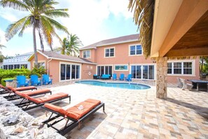 The expansive pool patio offers generous seating for everyone.