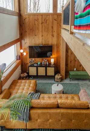 Atrium style living room with large sofa.