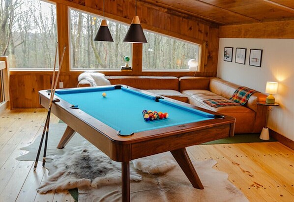 Custom Imperial pool table in loft. Full size sofa can sleep 2.