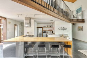 Modern kitchen hub! Perfect for sharing meals & making memories. Book your stylish escape.