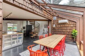 Unique glass-roofed dining! Gather around the table in this bright, airy space.