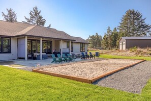 Sprawling sand pit built for yard games, perfect for endless fun and outdoor competition!