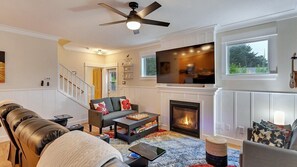 Cozy living room with fireplace & smart TV! Perfect for relaxing after exploring.