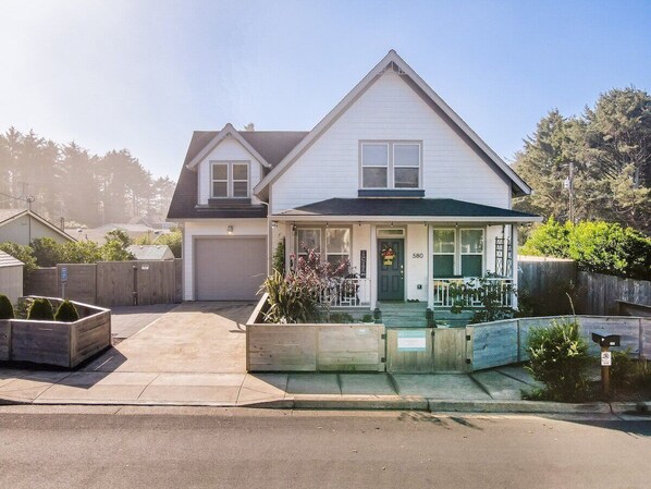 Welcome to Ohana Beach Park with a welcoming porch, a perfect blend of classic design and modern living.