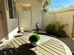 Zen rock garden is a peaceful coffee and email space w hummingbirds!