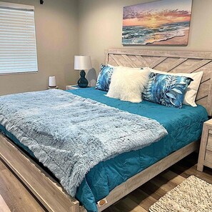 Primary king bedroom suite w walk-in closet and attached bathroom.