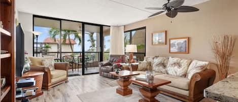Space - Comfort - Ocean Views - Enjoy a spacious living room with AC. The open floor plan flowing from a large, well equiped kitchen onto the full width wrap-around lanai.