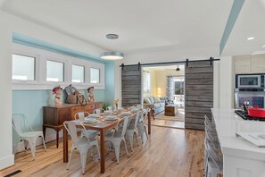 Large modern farmhouse dining table & esthetic for everyone to gather around.